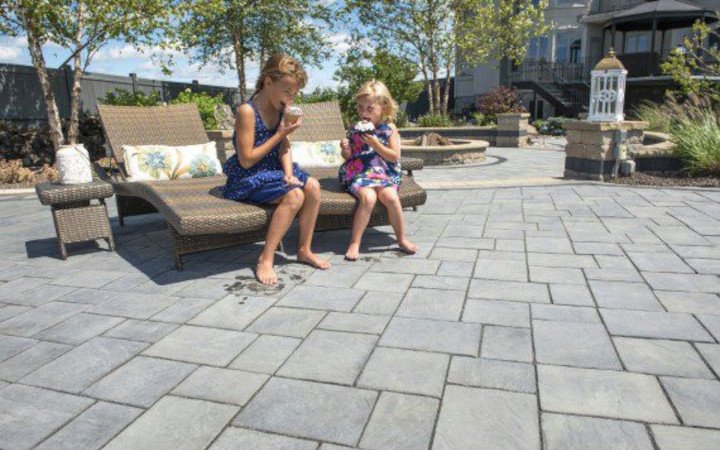 What types of materials are commonly used to make paver stones?