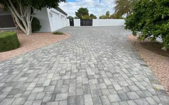 How do paver stones differ from traditional concrete or asphalt surfaces?