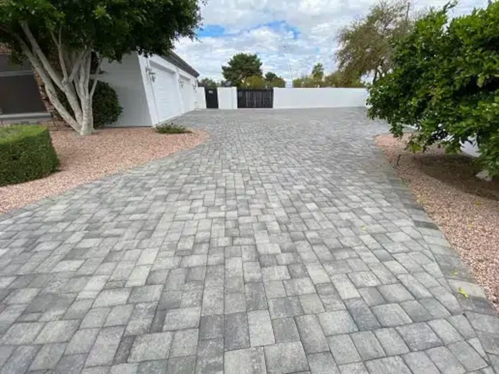 How do paver stones differ from traditional concrete or asphalt surfaces?